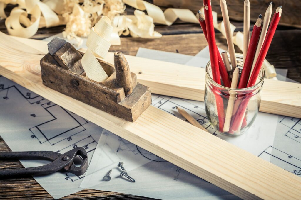 Antique carpentry workbench with tools on old wooden table