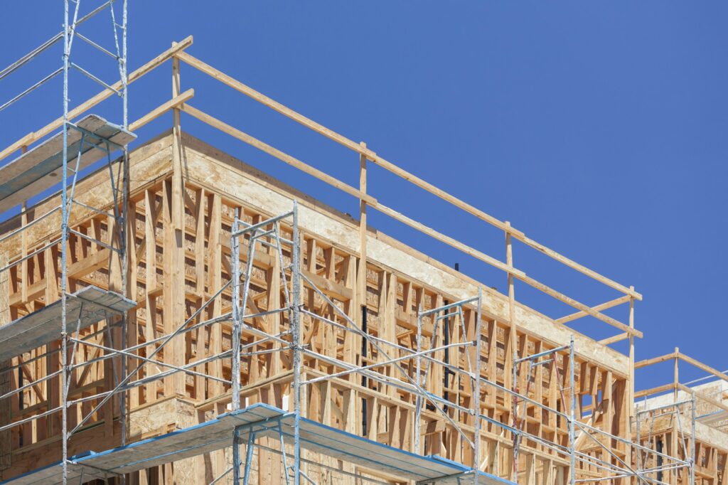 Scaffolding and Wood Framing at Construction Site.